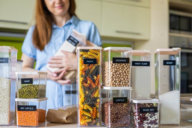 closeup-housewife-posing-with-marking-sticker-names-titles-bulk-products-plastic-case-box.jpg