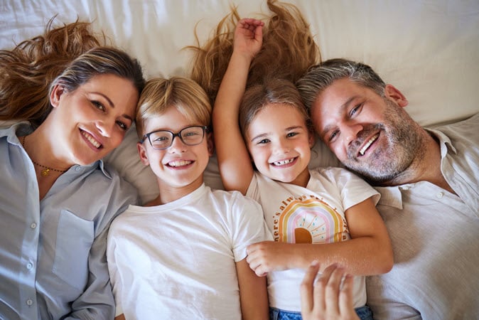 top-view-family-children-bonding-bedroom-house-home-hotel-parents-trust-love-security-portrait-smile-happy-kids-with-mature-father-mother-man-australian-woman.jpg