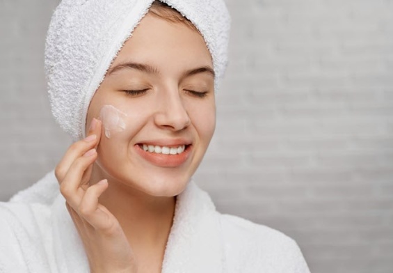 woman-applying-cream-hydrating.jpg